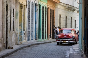 Colourful street with traditional old American car parked, Old Havana, Cuba Colourful street with traditional old American car parked, Old Havana, Cuba