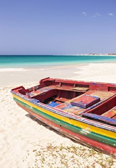 Colourful traditional local fishing boat on the beach at Santa Maria, Praia da Santa Maria Colourful traditional local fishing boat on the beach at Santa Maria, Praia da Santa Maria
