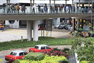 Commuters and taxis in Central, Hong Kong Island, Hong Kong, China, Asia Commuters and taxis in Central, Hong Kong Island, Hong Kong, China, Asia