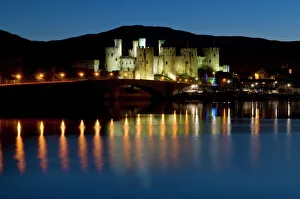 Conwy Castle and town at dusk, Conwy, Wales, United Kingdom, Europe Conwy Castle and town at dusk, Conwy, Wales, United Kingdom, Europe