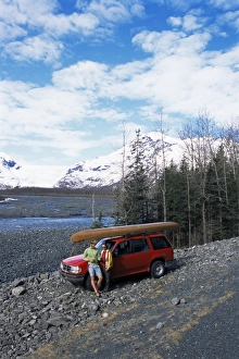 North America Road Trip Prints: Couple with canoe checking their map at Exit Glacier