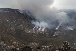 The crater with active lava lake of Mount Nyiragongo, Virunga National Park, UNESCO The crater with active lava lake of Mount Nyiragongo, Virunga National Park, UNESCO