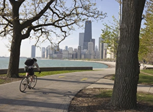 Cyclist by Lake Michigan shore, Gold Coast district, Chicago, Illinois Cyclist by Lake Michigan shore, Gold Coast district, Chicago, Illinois