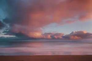 Dawn sky over Carbis Bay beach looking to Godrevy point, St. Ives, Cornwall, England, UK, Europe. Long exposure Dawn sky over Carbis Bay beach looking to Godrevy point, St. Ives, Cornwall, England, UK, Europe. Long exposure