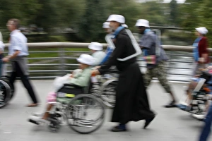 Disabled in Lourdes, Lourdes, Hautes Pyrenees, France, Europe Disabled in Lourdes, Lourdes, Hautes Pyrenees, France, Europe