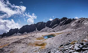 Spanish Mountain Scenery Prints: Dramatic rugged mountain range with a lake
