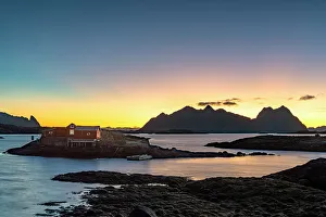 Scandinavian Coastal Scenes Prints: Dramatic sky at dawn over traditional rorbu