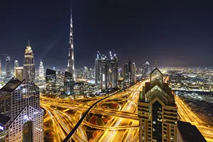 Dubai skyline and Sheikh Zayed Road Interchange by night, Dubai, United Arab Emirates Dubai skyline and Sheikh Zayed Road Interchange by night, Dubai, United Arab Emirates