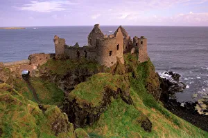 Prints of Dunluce castle, spectacular castle-crowned crag, Antrim coast, near Portrush, County Antrim, Ulster, Northern Ireland, United Kingdom, Europe Castle Prints: Dunluce Castle Print, Antrim Coast Landscape