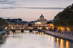 Images Dated 1st August 2016: Dusk lights on Tiber River with bridge Umberto I and Basilica di San Pietro in the background