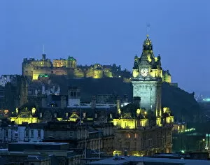 Hotel Collection: Edinburgh Castle and the Waverley Hotel clock tower illuminated at dusk
