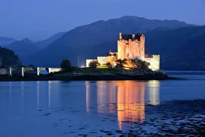 Eilean Donan Castle floodlit at night on Loch Duich, near Kyle of Lochalsh Eilean Donan Castle floodlit at night on Loch Duich, near Kyle of Lochalsh