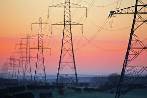 Electricity pylons at daybreak, Derbyshire/Nottinghamshire border, England, United Kingdom, Europe Electricity pylons at daybreak, Derbyshire/Nottinghamshire border, England, United Kingdom, Europe