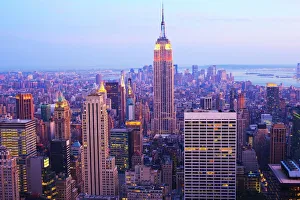 Empire State Building and Manhattan cityscape at dusk, New York City, New York Empire State Building and Manhattan cityscape at dusk, New York City, New York