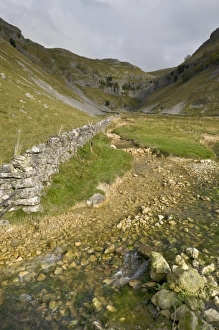 Entrance to Malham Cove with threatening clouds overhead, Yorkshire, England Entrance to Malham Cove with threatening clouds overhead, Yorkshire, England