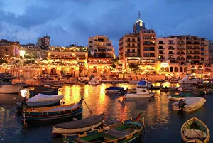 Evening across Spinola Bay with restaurants, St. Julian`s, Malta, Mediterranean, Europe Evening across Spinola Bay with restaurants, St. Julian`s, Malta, Mediterranean, Europe