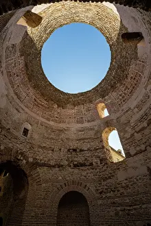 Prints of Exploring the ancient cellars of Diocletians Palace in Split, Croatia with a view of the sky through the dome Split Prints: Diocletians Palace Cellar Print with Dome View