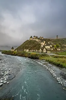 Prints of Exploring ancient structures in the city of the Dead, Dargavs, located in North Ossetia, Russia, near a flowing river and rolling hills Russian Architecture Prints: Print of Dargavs ancient structures in North Ossetia, Russia