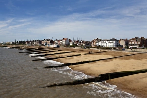 Felixstowe Beach from the pier with Container Port cranes in the distance, Felixstowe, Suffolk, England, United Kingdom Felixstowe Beach from the pier with Container Port cranes in the distance, Felixstowe, Suffolk, England, United Kingdom