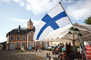 Prints of Finnish flag and medieval Town Hall, Old Town Square, Porvoo, Uusimaa, Finland, Scandinavia, Europe Finland Prints: Finnish Flag Print with Porvoo Town Hall