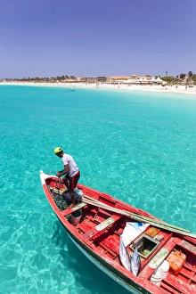 Fisherman with his catch of fish in a traditional fishing boat, Santa Maria, Sal Island Fisherman with his catch of fish in a traditional fishing boat, Santa Maria, Sal Island