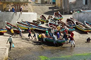 Fishermen taking boat out of water at the port of Ponto do Sol, Ribiera Grande Fishermen taking boat out of water at the port of Ponto do Sol, Ribiera Grande