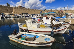 Fishing boats, Commercial harbour and Medieval walls, Old Rhodes Town, UNESCO World Heritage Site Fishing boats, Commercial harbour and Medieval walls, Old Rhodes Town, UNESCO World Heritage Site