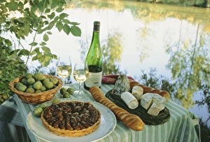 Food and wine on a table beside the river Loire, France, Europe Food and wine on a table beside the river Loire, France, Europe