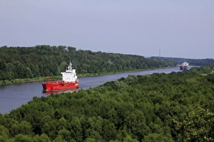 Freight Ships on Kiel Canal going near Hochdonn, Dithmarschen, Schleswig-Holstein Freight Ships on Kiel Canal going near Hochdonn, Dithmarschen, Schleswig-Holstein