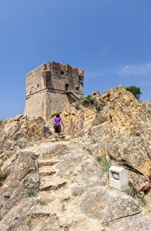 Genoese tower of granite rocks built as fortress of defense framed by blue sky, Porto Genoese tower of granite rocks built as fortress of defense framed by blue sky, Porto