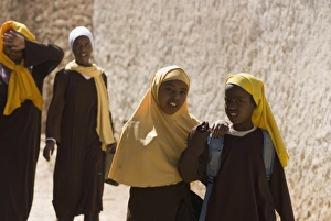 Girls stepping out of school in Harar, Ethiopia, Africa Girls stepping out of school in Harar, Ethiopia, Africa