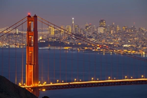 The Golden Gate Bridge and San Francisco skyline at night, San Francisco, California, United States of America The Golden Gate Bridge and San Francisco skyline at night, San Francisco, California, United States of America