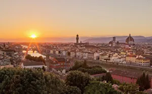 Golden rays over the Ponte Vecchio and Duomo as the sun sets over Florence, UNESCO Golden rays over the Ponte Vecchio and Duomo as the sun sets over Florence, UNESCO