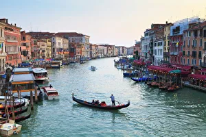 A gondola crossing the Grand Canal, Venice, UNESCO World Heritage Site A gondola crossing the Grand Canal, Venice, UNESCO World Heritage Site