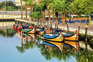 Gondola-like moliceiros boats anchored along the Central Channel, Aveiro, Beira, Portugal, Europe Gondola-like moliceiros boats anchored along the Central Channel, Aveiro, Beira, Portugal, Europe