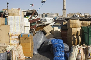 Goods on dock waiting to be loaded onto dhows for transportation Goods on dock waiting to be loaded onto dhows for transportation