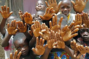 Group of children showing their hands, Datcha-Attikpaye, Togo, West Africa, Africa Group of children showing their hands, Datcha-Attikpaye, Togo, West Africa, Africa