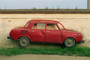 Half a Skoda on a wall in a car salesyard near Piestany Half a Skoda on a wall in a car salesyard near Piestany