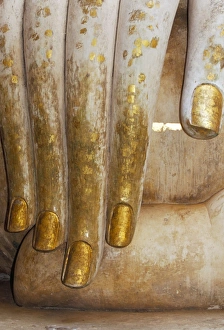 Detail of the hand of a stucco seated Buddha statue Detail of the hand of a stucco seated Buddha statue