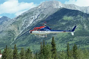 Helicopter in the Rocky Mountains, British Columbia, Canada, North America Helicopter in the Rocky Mountains, British Columbia, Canada, North America