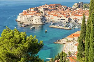 High-angle view over the old town of Dubrovnik and Banje Beach, Dubrovnik, Croatia High-angle view over the old town of Dubrovnik and Banje Beach, Dubrovnik, Croatia