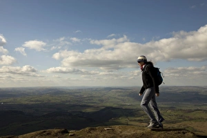 A hiker walks north from Hay Bluff, above Hay-on-Wye, Brecon Beacons National Park A hiker walks north from Hay Bluff, above Hay-on-Wye, Brecon Beacons National Park