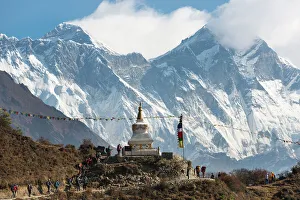 Hoards of trekkers make their way to Everest Base Camp, Mount Everest is the peak on the left Hoards of trekkers make their way to Everest Base Camp, Mount Everest is the peak on the left