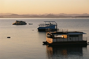 Houseboats at dawn at Cutty Sark Hotel marina, Lake Kariba, Zimbabwe, Africa Houseboats at dawn at Cutty Sark Hotel marina, Lake Kariba, Zimbabwe, Africa
