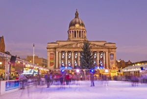 Ice skaters on the temporary Christmas outdoor ice skating rink in the Old Market Square Ice skaters on the temporary Christmas outdoor ice skating rink in the Old Market Square