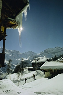 Snowy Mountain Landscape Switzerland Prints: Icicles on chalet and deep snow