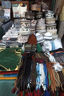 Islamic items including prayer mats and Muslim caps on sale at the market in the European Islamic items including prayer mats and Muslim caps on sale at the market in the European