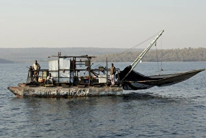 Kapenta fishing boat and crew, early morning, Lake Kariba, Zimbabwe, Africa Kapenta fishing boat and crew, early morning, Lake Kariba, Zimbabwe, Africa