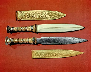 The kings two daggers, one with a blade of gold, the other of iron The kings two daggers, one with a blade of gold, the other of iron