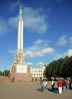 Latvians and guards in front of the Freedom Monument in the city of Riga Latvians and guards in front of the Freedom Monument in the city of Riga